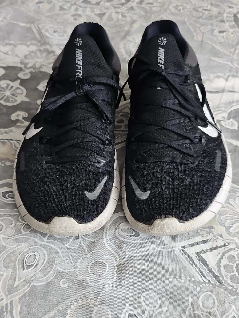 Nike Black Athletic Shoes with White Swoosh